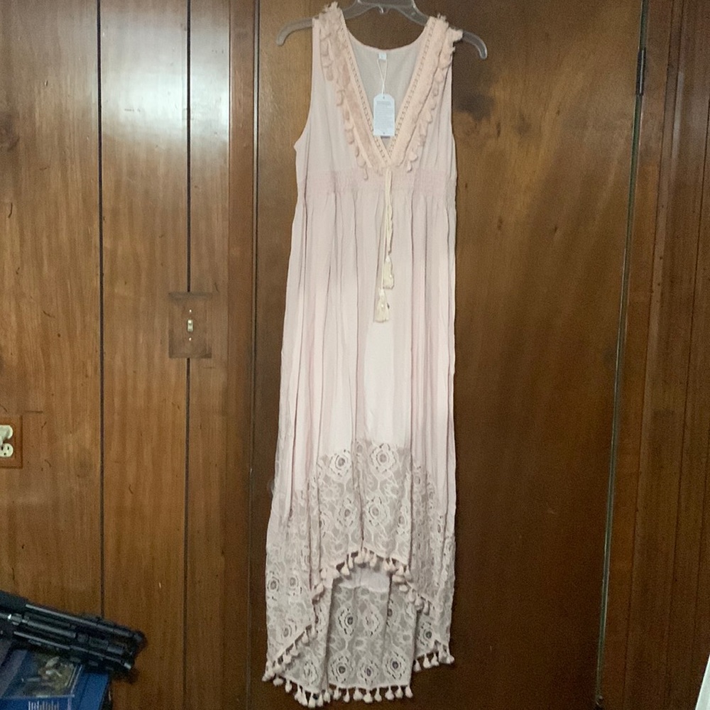Light pink flowy dress.
